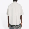Camicia da uomo Balenciaga in cotone a maniche corte e dal taglio ampio, grigia 664627TKM102967