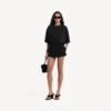 Gonna-pantaloncino mini da donna su misura in nero Gonna-pantaloncino mini da donna su misura in nero