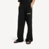 Pantaloni da ginnastica larghi da uomo con stampa spray “messy” in nero Pantaloni da ginnastica larghi da uomo con stampa spray “messy” in nero