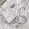 Pochette da donna Rodeo con tracolla a bandoliera e strass in grigio fumo Pochette da donna Rodeo con tracolla a bandoliera e strass in grigio fumo