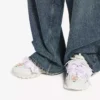 Sneaker da donna con fiocco in stile Track in bianco/rosa Sneaker da donna con fiocco in stile Track in bianco/rosa