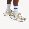Sneaker da uomo 3XL con ciondoli nei colori bianco/giallo/argento/nero Sneaker da uomo 3XL con ciondoli nei colori bianco/giallo/argento/nero