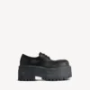 Stringate da donna con plateau Strike in nero Stringate da donna con plateau Strike in nero
