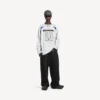T-shirt da uomo a maniche lunghe oversize Balenciaga | Collaborazione NBA in bianco/multicolore T-shirt da uomo a maniche lunghe oversize Balenciaga | Collaborazione NBA in bianco/multicolore